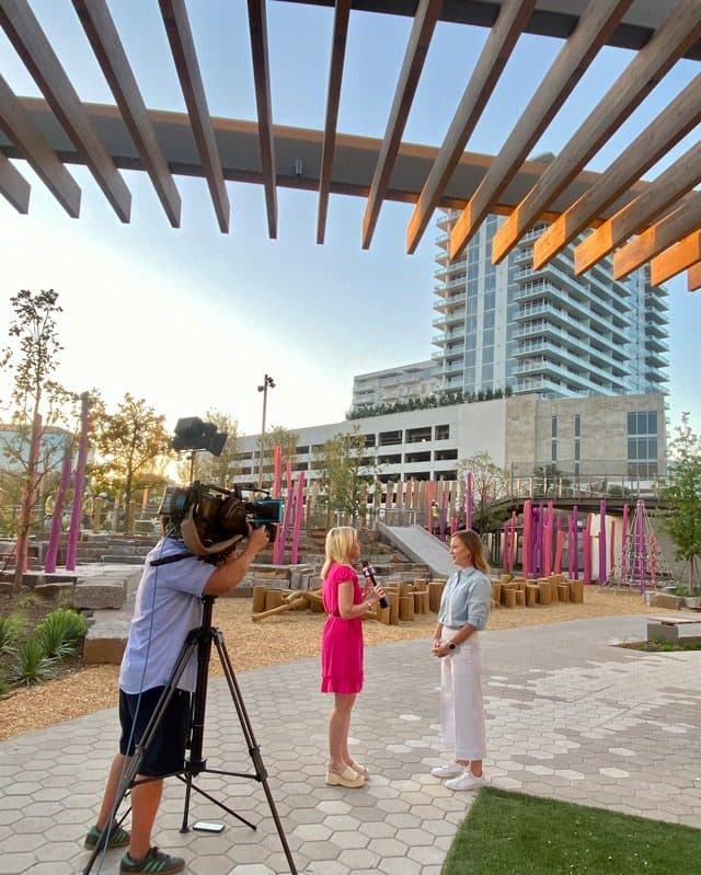 TV crew filming an interview on the plaza